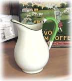 Rare tiny little green and cream enamel jug.