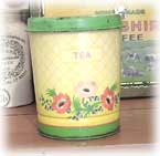 A Paca tea tin with floral decoration.