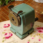 Old green school pencil sharpner.