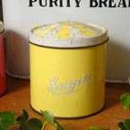 A yellow sugar carnival kitchen tin.