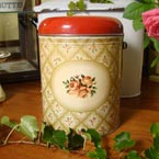 A Worcesterware flour tin roses decoration.