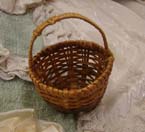 Tiny dolls wicker basket.