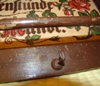 Antique German shelf with hooks.